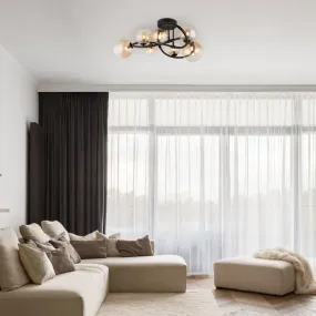 Tuberius Ø62 Keltainen plafondi valmistajalta Globo Lighting - Lampan &auml;r tillverkad av mattsvart metall och &auml;r smyckad med 7st glas i en&nbsp;mjuk b&auml;rnstensf&auml;rgad ton, vilket skapar en st&auml;mningsfull ljusspridning.