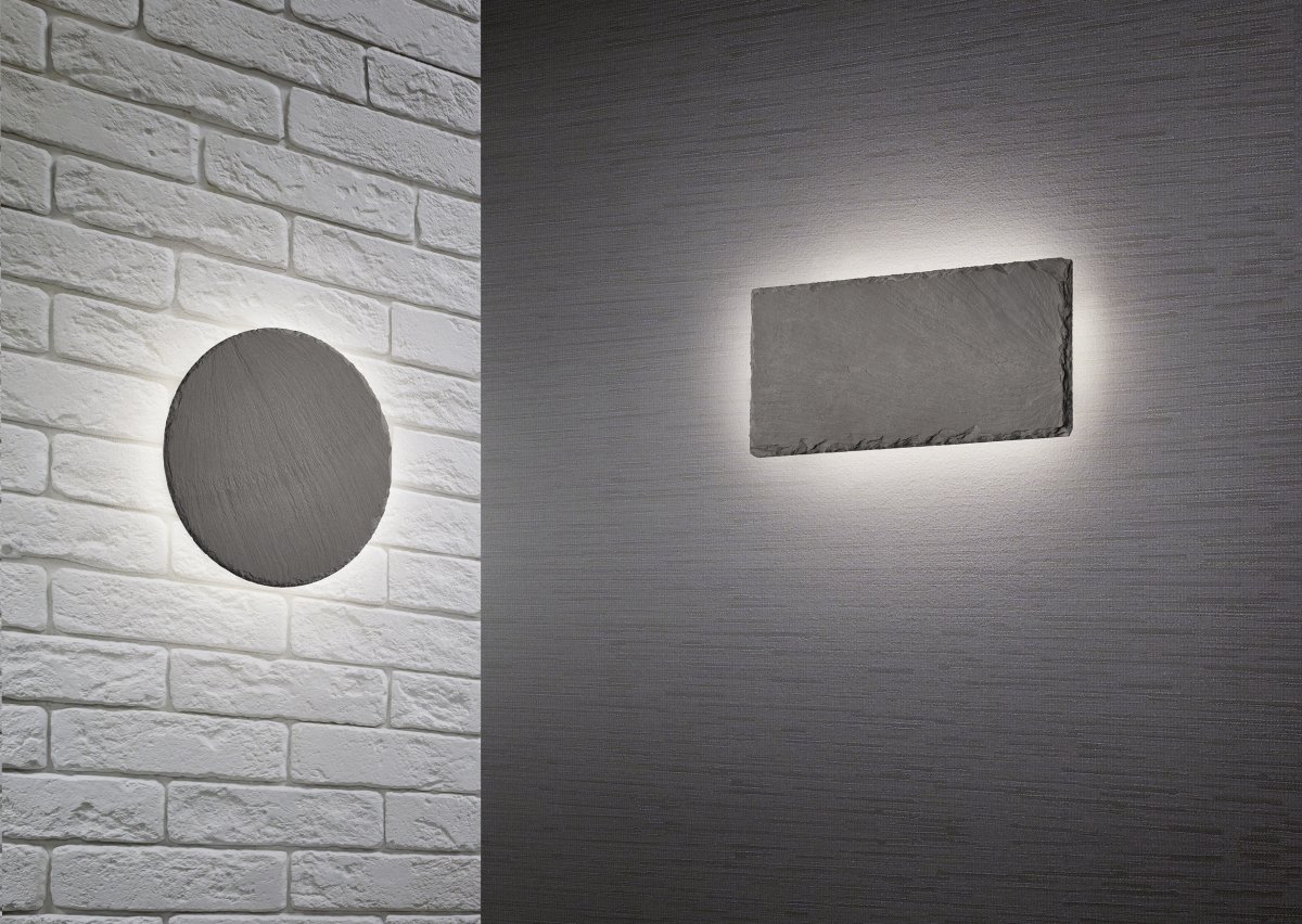 Raven Ø20 Musta seinävalaisin valmistajalta Trio Lighting - Raven-sein&auml;valaisin on taattu katseenvangitsija elegantilla liuskekivikuviollaan ja koristeellisella luonteellaan.