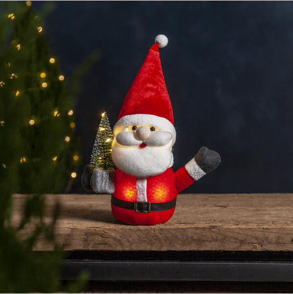 Joylight Tonttu PUNAINEN valmistajalta Star Trading - Mukava joulupukki paketilla ja joulukuusella.