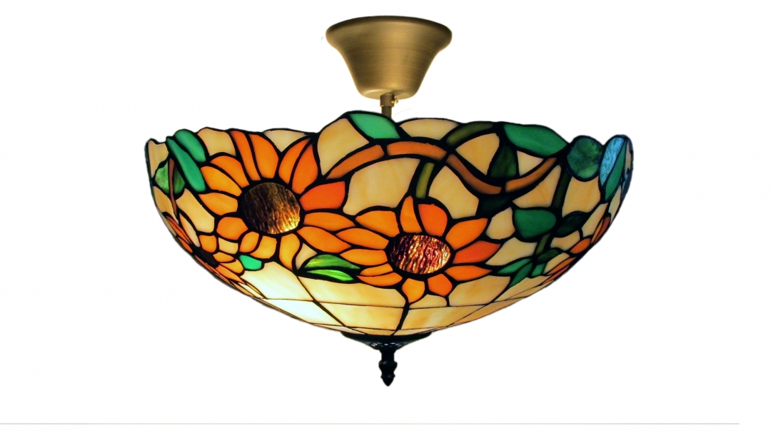 Solros Ø40 Monivärinen valmistajalta Norrsken Design - Sunflower on klassinen Tiffany-valaisin, jossa on kaunis muotoilu, jossa on erivärisiä auringonkukkia ja lehtiä.