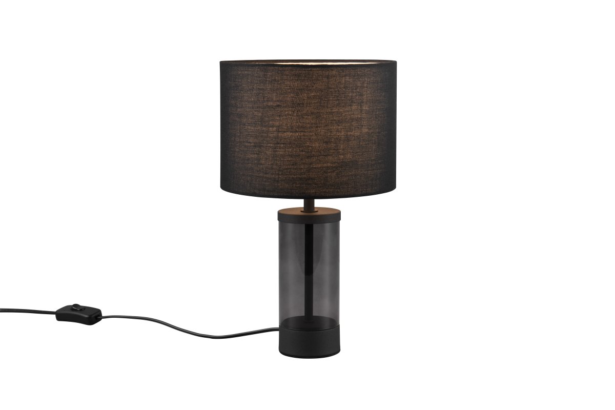 Grazia 34cm Musta pöytävalaisin valmistajalta Trio Lighting - Pöytävalaisin Grazia yhdistää tyylikkään kangasvarjostimen tyylikkääseen lieriömäiseen lasi- ja metallijalkaan, mikä antaa harmonisen ja hienostuneen vaikutelman.