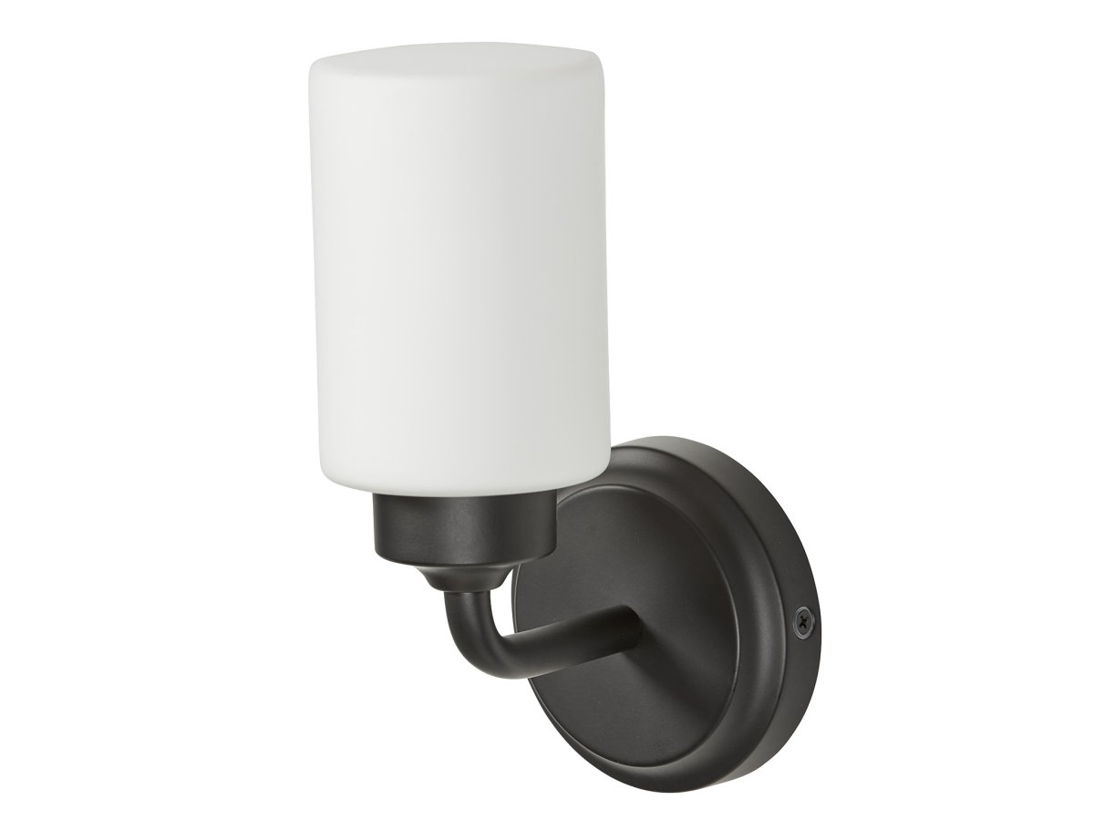 Boda 22cm Musta kylpyhuoneen valaisin valmistajalta Armaturhantverk - Mustien yksityiskohtien ja valkoisen lasikuvun ansiosta se levittää pehmeää ja miellyttävää valoa, joka sopii täydellisesti peilivalaistukseen tai yleisvalaistukseen.